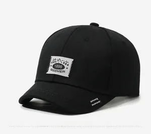 Close-up of black cotton baseball cap showing detailed 1998 GOODVIEW label and stitching