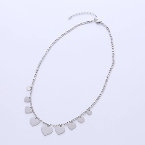 Minimalist silver Figaro chain necklace with multiple heart sequins on white background
