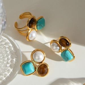 Three-stone jewelry set with pearl and tiger eye on gold open ring and stud earrings