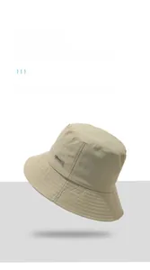 Detail of khaki sun hat featuring Harason label and reinforced multi-stitch brim design