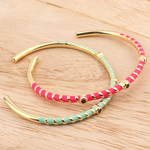 Golden open bangle bracelets with colorful enamel stripes and inlaid black crystal dots