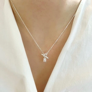 Detail of 925 sterling silver necklace featuring OT toggle clasp and clear zircon pendant