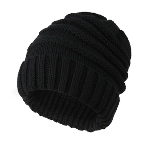 Detailed view of thick vertical knit texture and wide cuff on black winter beanie