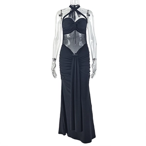 Detail of black halter neck dress featuring sheer mesh cut-out and ruched fishtail hem