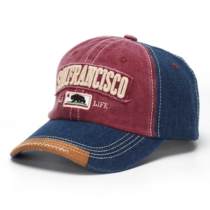 Detail of vintage baseball cap with San Francisco embroidery and bear patch on washed fabric