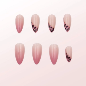 Pink gradient almond press-on nails with leopard print patterns and gold foil accents