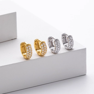Detailed close-up showing S925 hallmark on gold and silver pavé hoop earrings