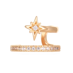 Macro view of gold ear cuff with an eight-pointed star and white zircon pavé setting