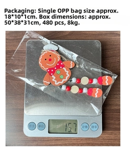 Wooden gingerbread man ornament showing weight measurement on an electronic scale