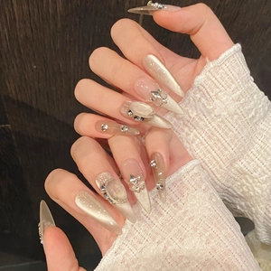 Handmade press-on nails with cat eye pearl effect, French chain, and oval rhinestones