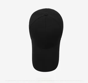 Top-down view of a black six-panel baseball cap showing the FIRST logo and crown button