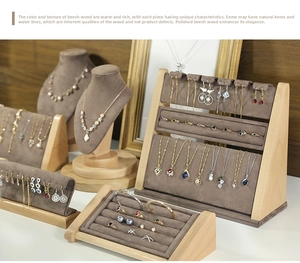 Detailed view of wooden jewelry display set with brown microfiber for necklaces and rings