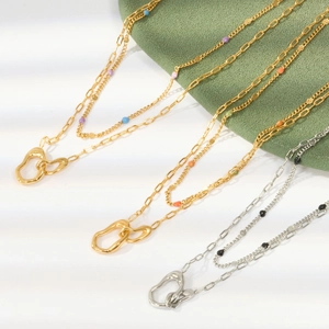 Detail of double-layer stainless steel heart necklace with colorful enamel beads