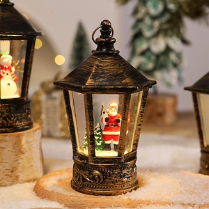 Close-up of vintage bronze Christmas lantern with Santa Claus and cedar scene inside
