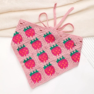 Close-up of pink crochet headband with detailed red strawberry knitted patterns