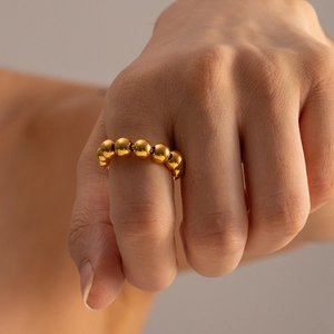 Minimalist 18k gold plated stainless steel ring featuring a graduated beaded ball design