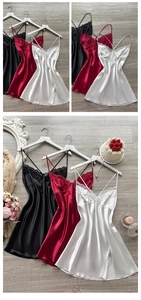 Detail of silk-satin slip nightgown with lace trim and side slits in multiple colors
