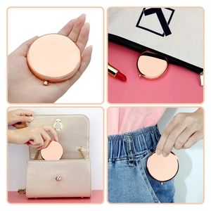 Rose gold round portable makeup mirror shown in hand and bag for daily use