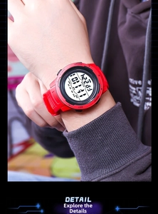 Detail view of red digital sport watch with pedometer and alarm functions on wrist
