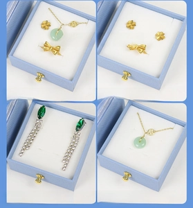 Macro view of light blue jewelry gift box showing ring slots and necklace hooks