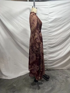 Detail of bohemian paisley print chiffon maxi dress with pleated bodice and long sleeves