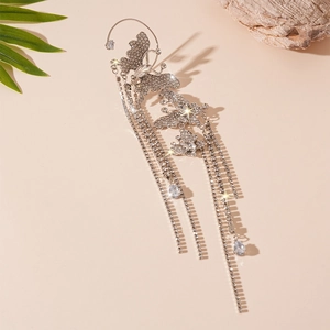 Detailed view of silver butterfly ear cuff with sparkling rhinestone tassels decoration
