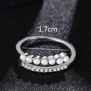 Adjustable silver ring with double layer design featuring white pearls and clear zircons