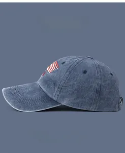 Detail of red and white stripe embroidery on a washed cotton denim baseball cap