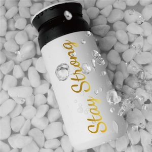 Golden Stay Strong lettering on black and white stainless steel vacuum insulated bottle
