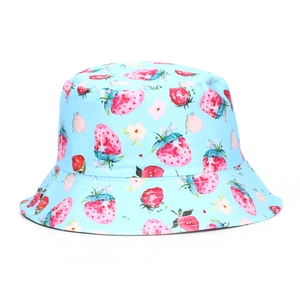 Detailed close-up of sky blue sun hat with digital strawberry and floral prints