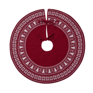 Red knitted Christmas tree skirt with white snowflake patterns and ribbon ties