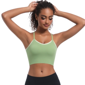 Close-up of mint green sports bra with white contrast piping and high elasticity fabric