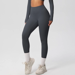 Detail view of high waisted dark grey leggings showing elastic compression and sculpting fabric
