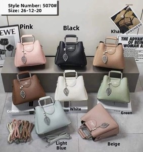 Detail view of lychee pattern leather bags with chain handles in 8 various colors