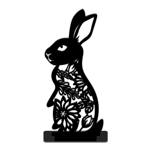 Detailed view of the intricate floral cut-out patterns on the black rabbit ornament
