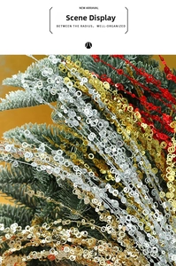 Close-up of sparkling gold silver and red sequin fireworks sticks for Christmas decor