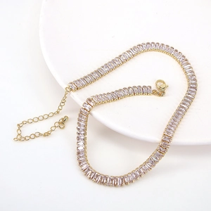 Elegant gold tennis choker necklace featuring rectangular clear cubic zirconia stones