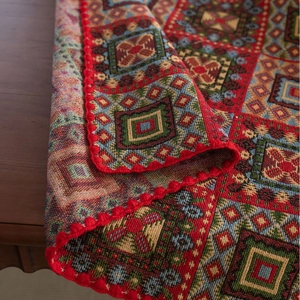 Jacquard tablecloth with red crochet edges and festive geometric embroidery patterns
