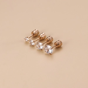 Macro shot of rose gold stainless steel stud earrings set with clear zircon stones