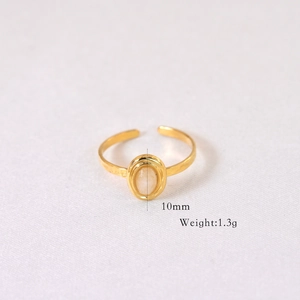 Detailed view of gold ring with oval natural stone weighing 1.3g and 10mm height