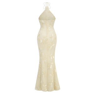 Detail of floral embroidery and sequins on back of champagne halter mermaid dress