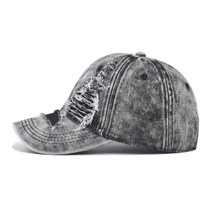 Retro washed grey denim baseball cap with distressed ripped details and frayed edges