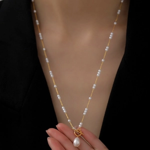 Baroque pearl drop necklace with gold OT buckle and petite pearls on a long chain
