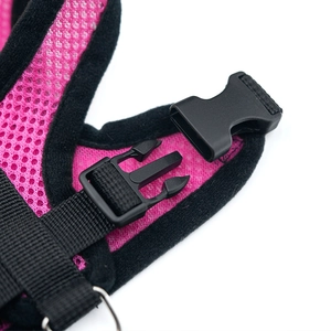Close-up of pink pet harness with breathable mesh, nylon webbing and quick-release buckle