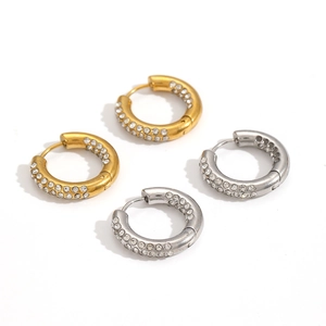 Close-up of gold and silver hoop earrings featuring micro-pave white cubic zirconia stones