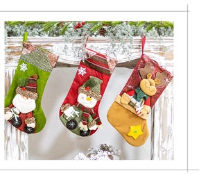 Detail of 3D Santa, Snowman and Reindeer knit Christmas stockings on fireplace mantel