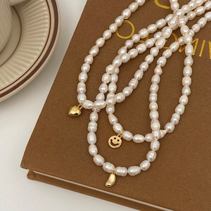 French vintage freshwater pearl necklace with gold heart and smiley face pendants