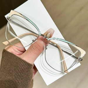 Stylish cat-eye metal glasses frame in silver with beige and mint green color contrast