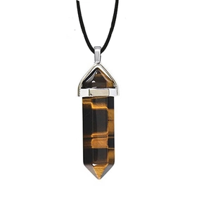 Macro detail of hexagonal tiger eye crystal pendant with silver clasp and black cord necklace