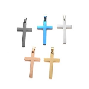 Detailed view of polished cross pendants in black blue silver rose gold and gold finishes